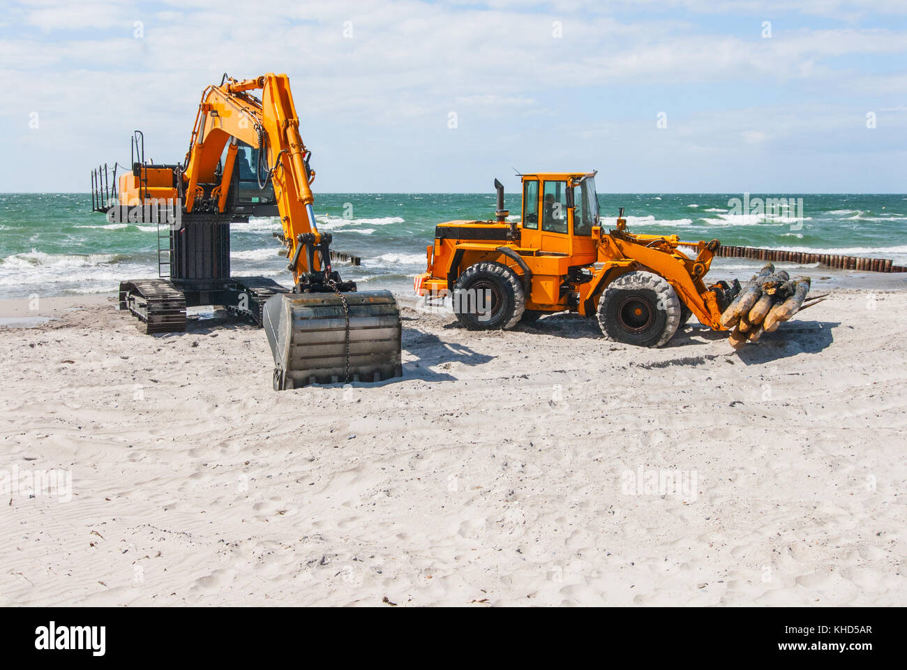Excavator on a beach hires stock photography and images Alamy
