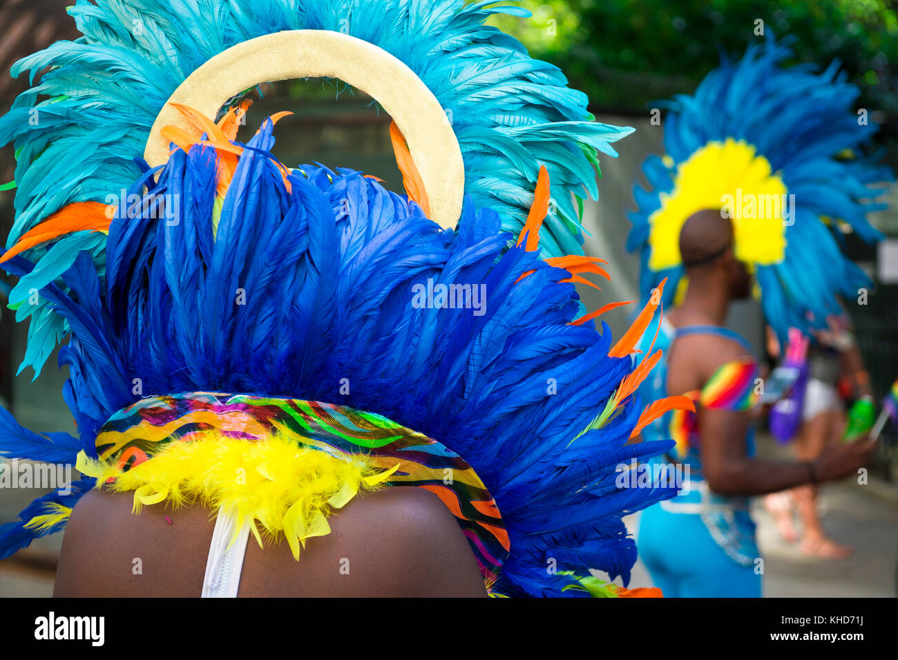 Group of dancers wearing colorful feathers costumes gathered for a