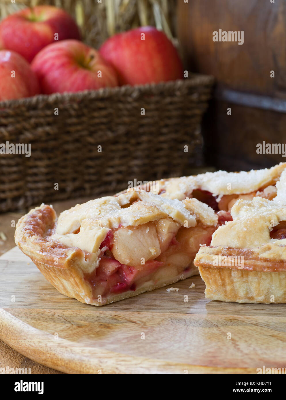 Slice of apple cranberry pie on a wooden platter Stock Photo