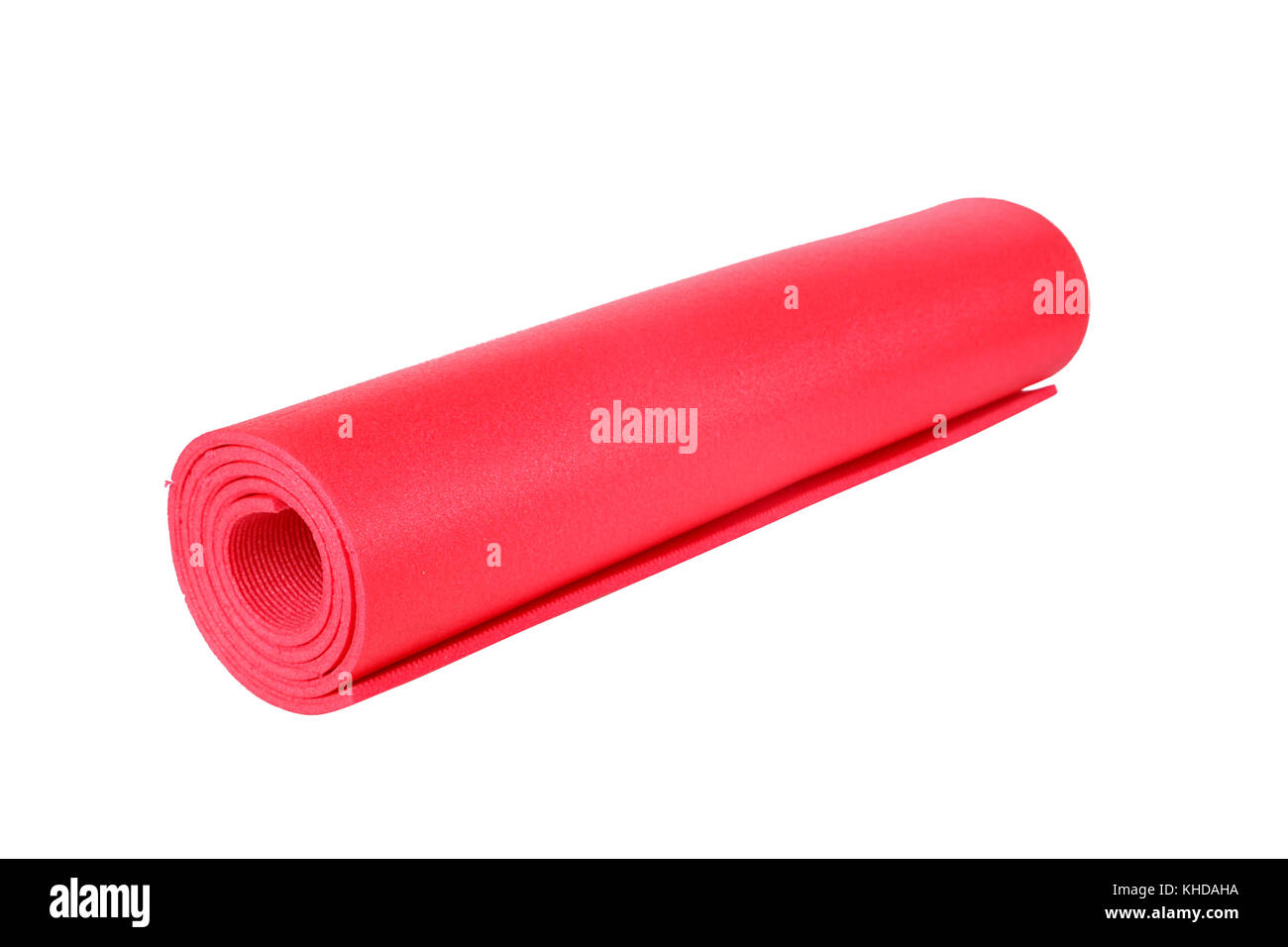 Healthy life and sport concept, red yoga or pilates mat, isolated on white background. Stock Photo