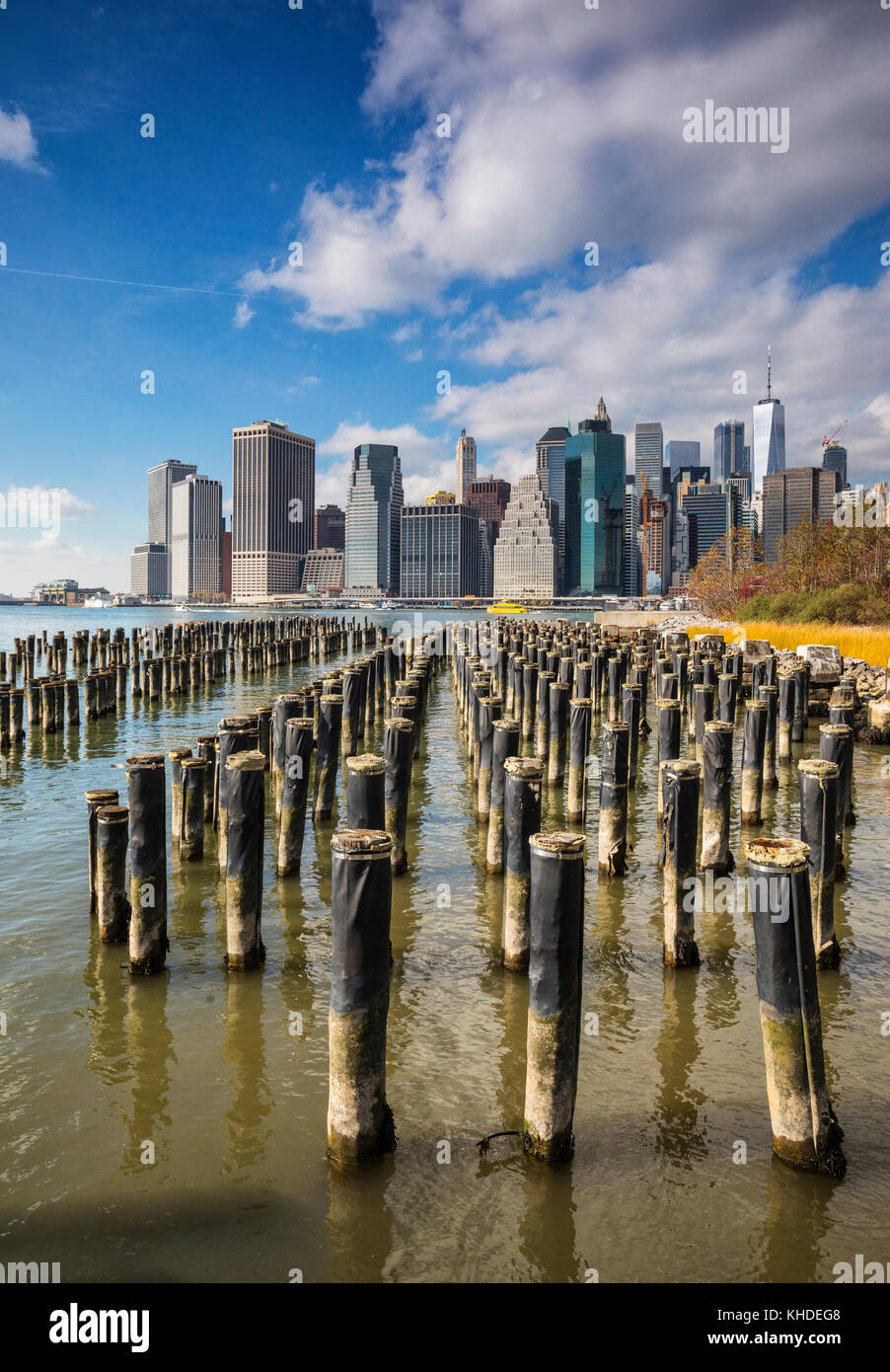 Downtown Manhattan with wood pilings in front, New York City Stock Photo