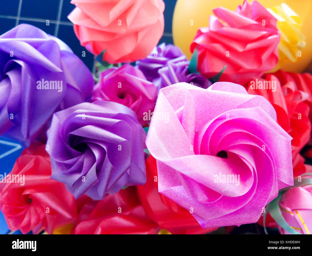Rose fake flower and Floral backgroundrose flowers made of fabric. The fabric flowers bouquet. Colorful of decoration artificial flower. Stock Photo