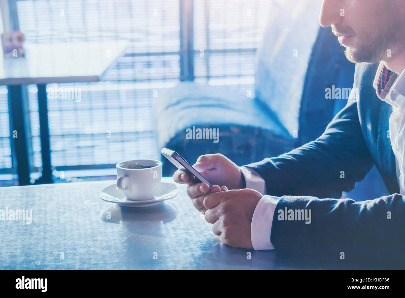 man using mobile phone, close up of hands holding smartphone, online communication on social networks concept Stock Photo