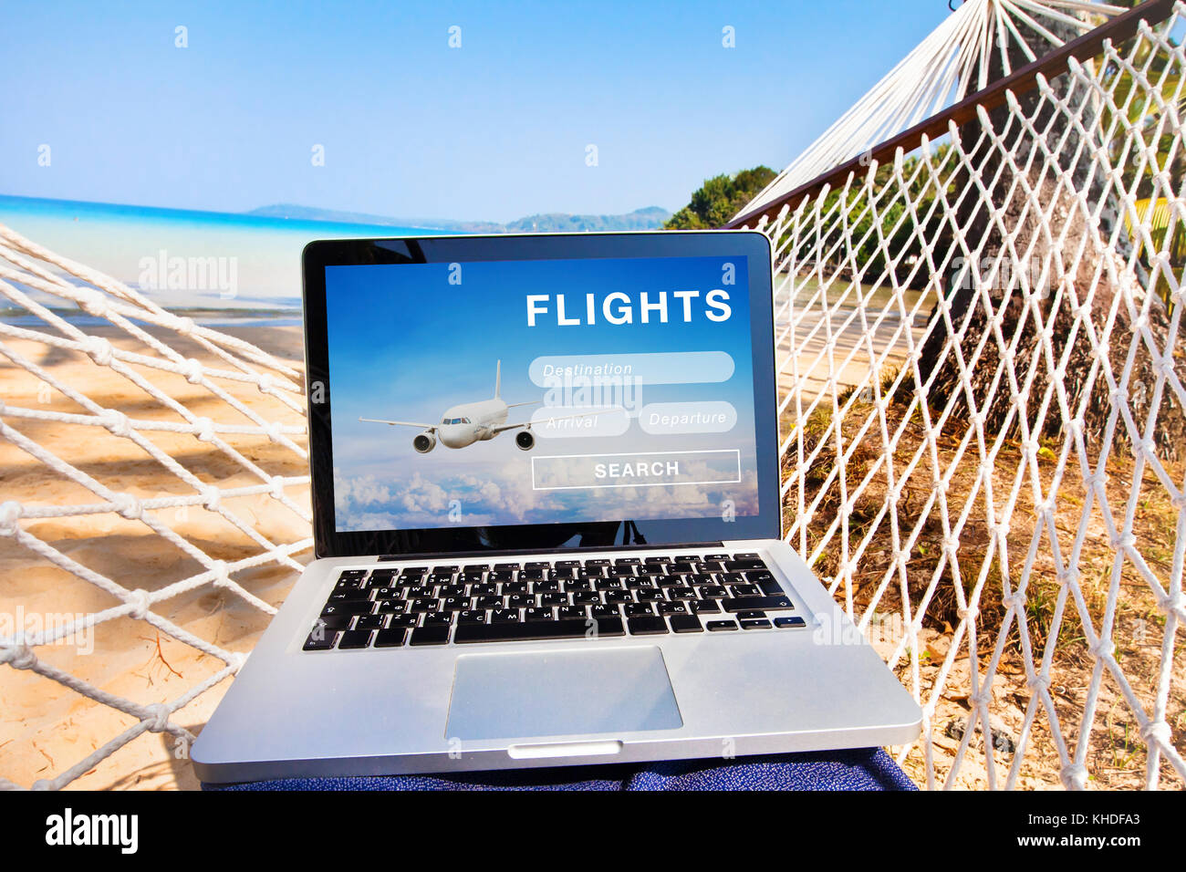 search flight tickets on internet, buy online website on the screen of laptop computer Stock Photo