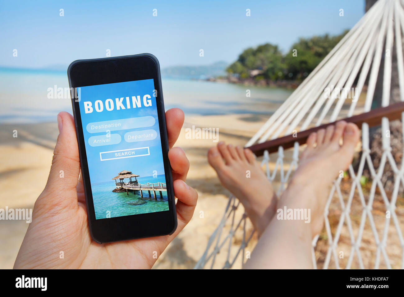 travel booking, hotels and flights reservation on the screen of smartphone Stock Photo