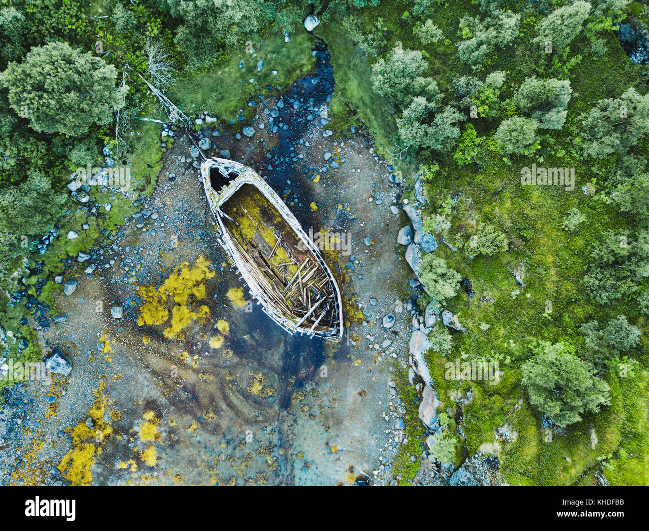 beautiful aerial shot of abandoned wooden boat on the beach Stock Photo ...