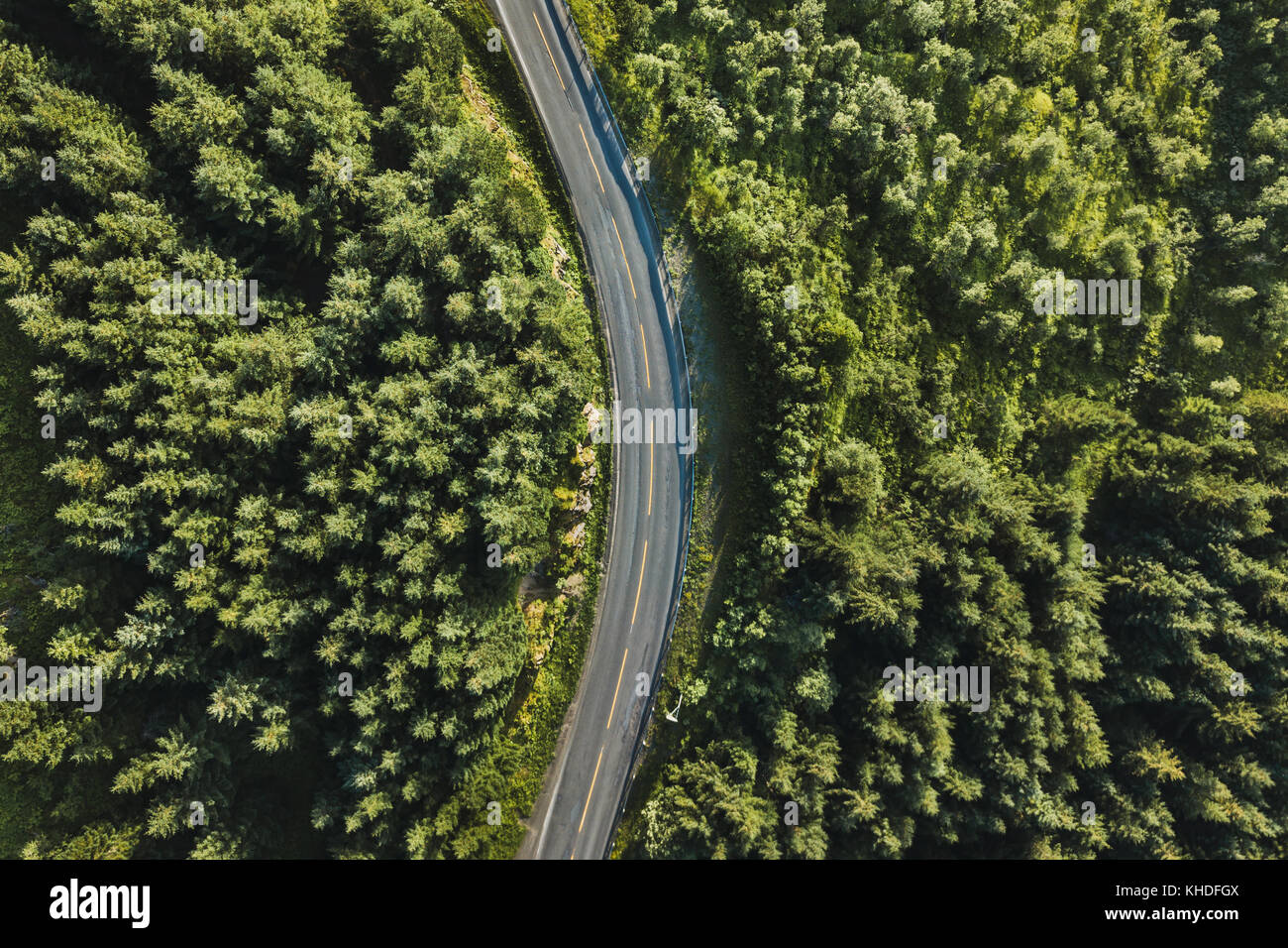 beautiful scenic road in the forest, aerial view from drone, travel ...