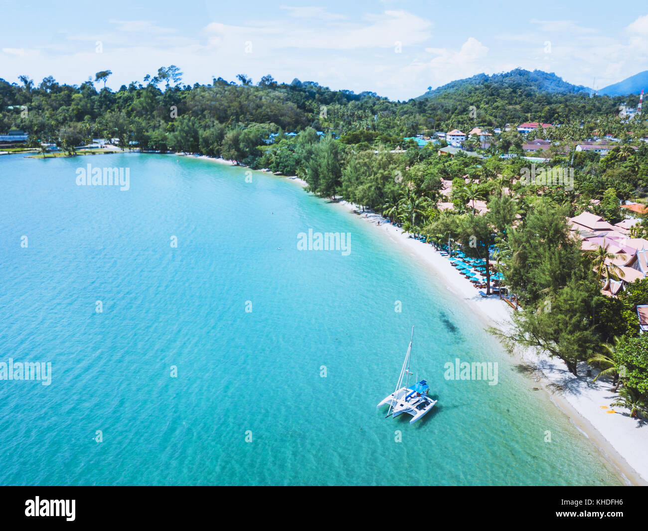 catamaran with sail anchored on beautiful tropical beach of Koh Chang island, Thailand aerial landscape Stock Photo