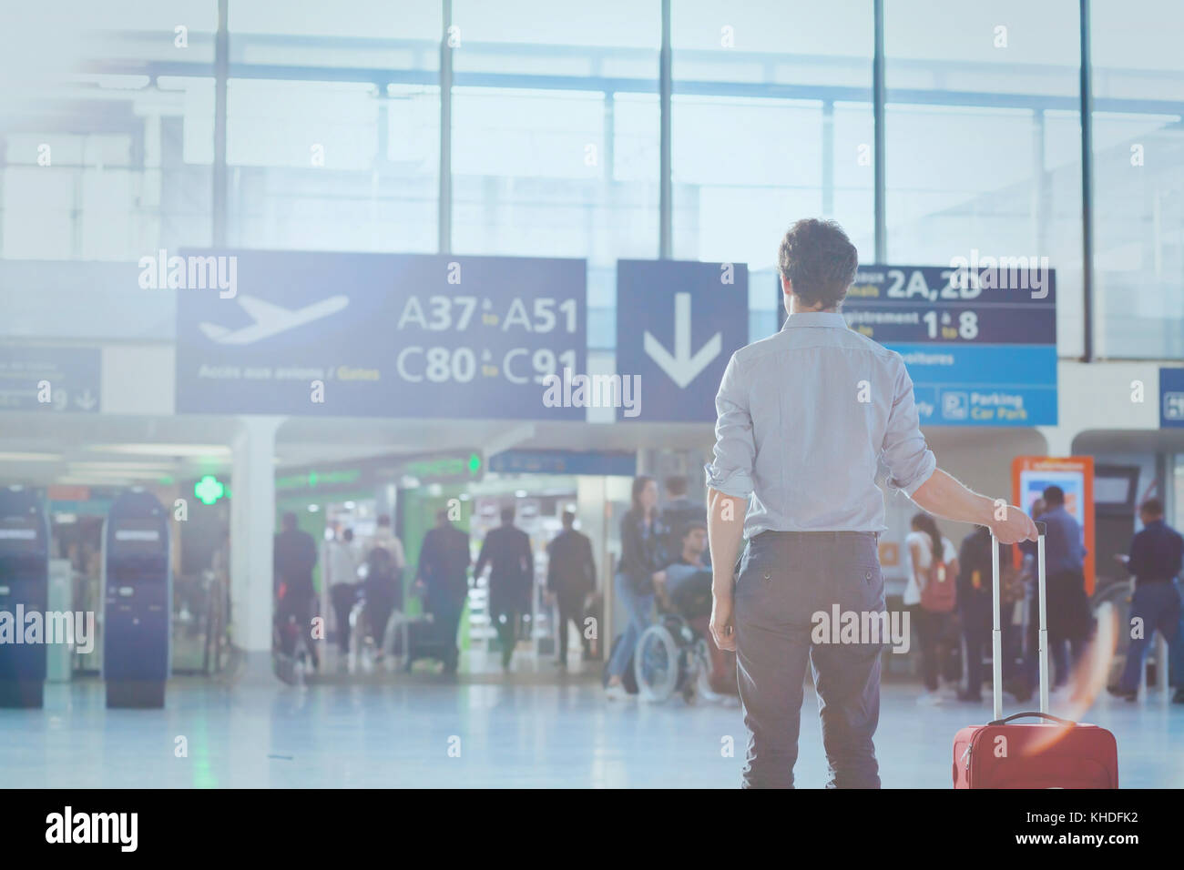 business travel, man passenger in airport waiting for the flight in modern terminal Stock Photo