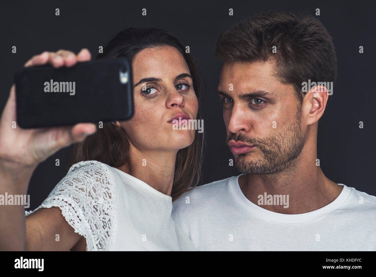 Couple posing for a selfie together Stock Photo - Alamy