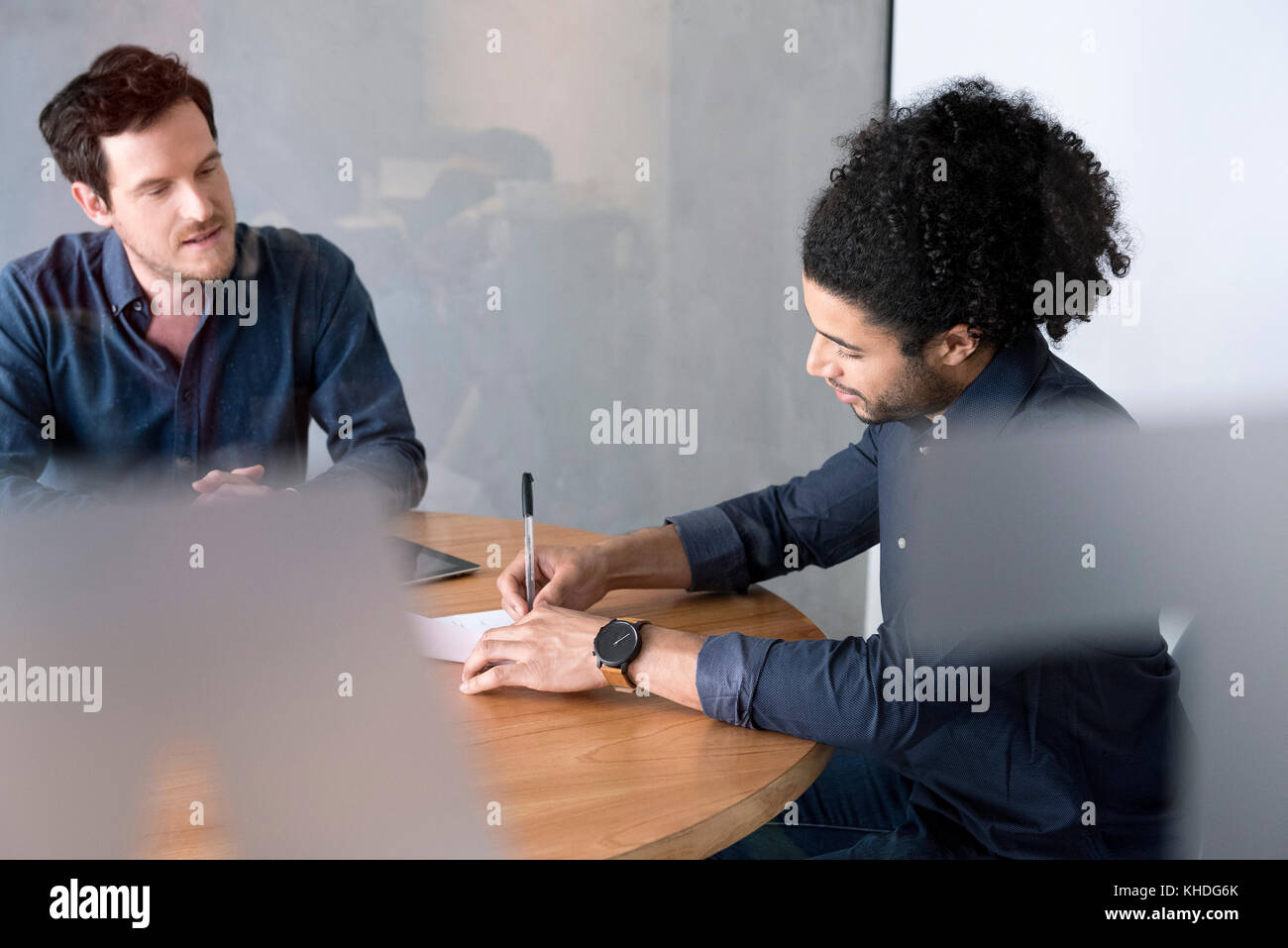 Man signing document Stock Photo