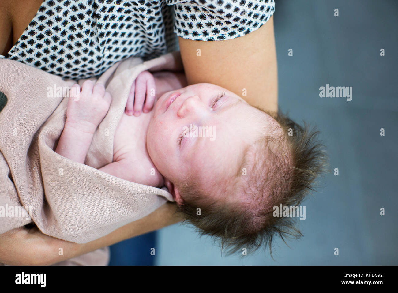 Mother holding new born baby Stock Photo