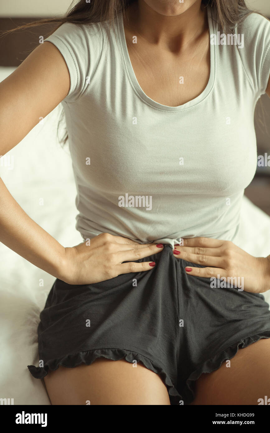 Woman being concerned about waistline Stock Photo
