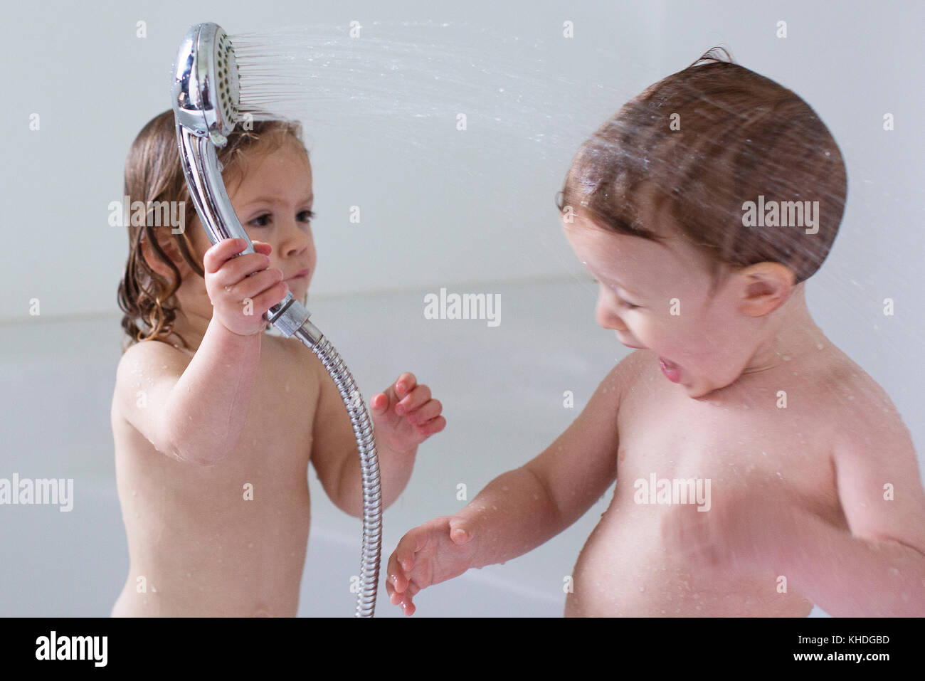 Children playing in bathtub Stock Photo
