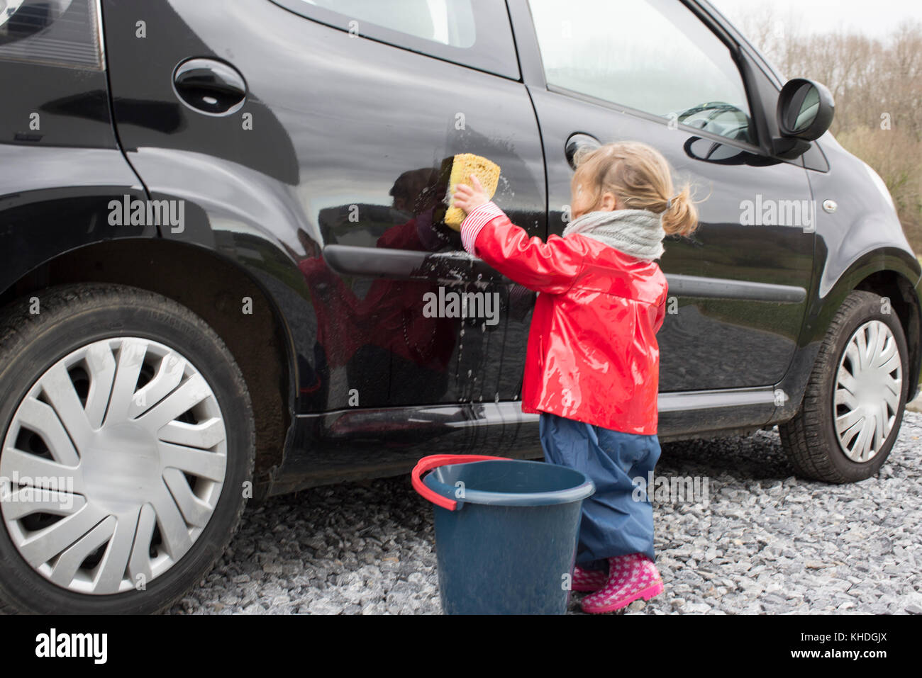 Little girl washing car Stock Photo