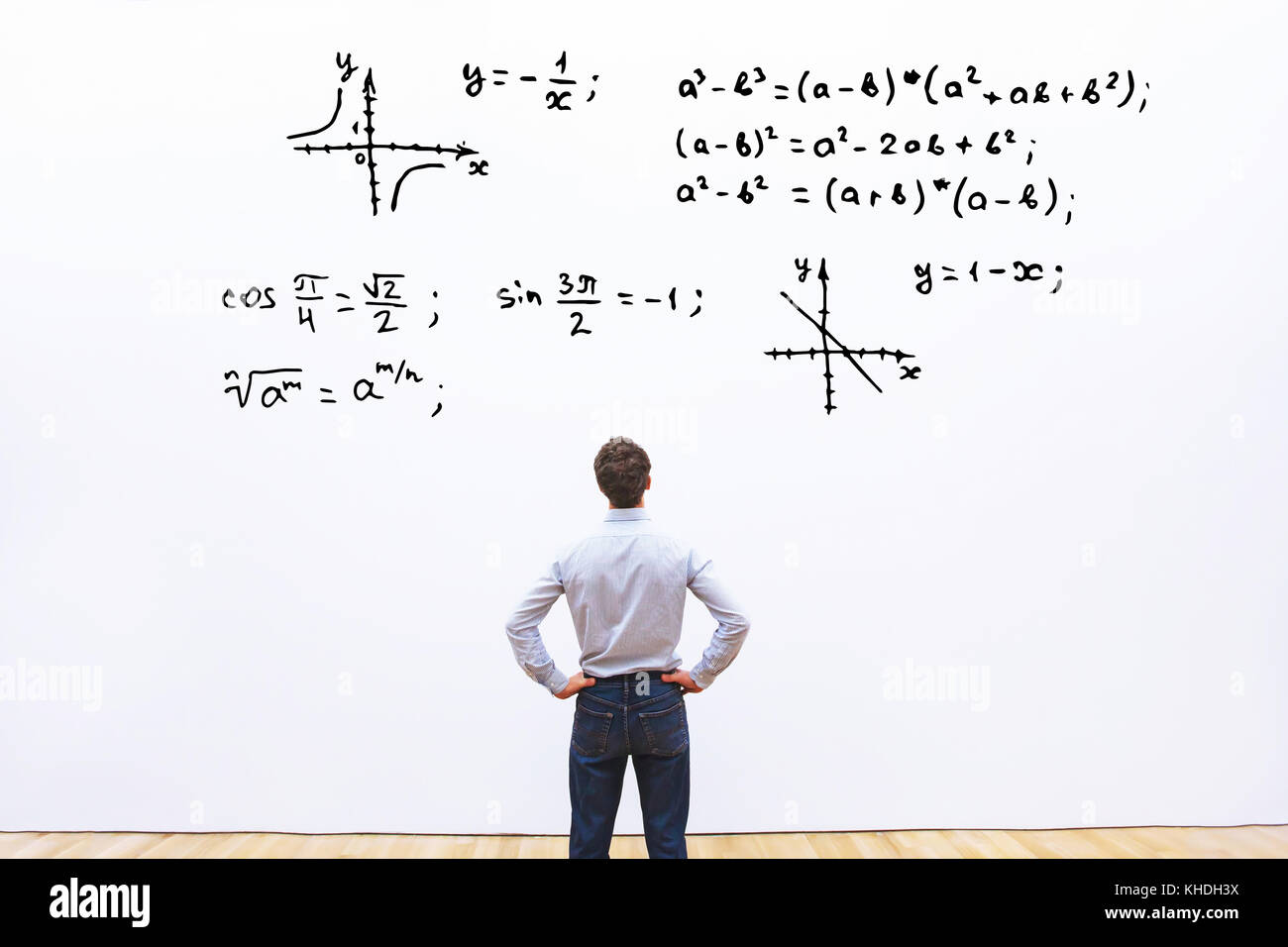 student looking at mathematical formulas, learn maths education concept Stock Photo