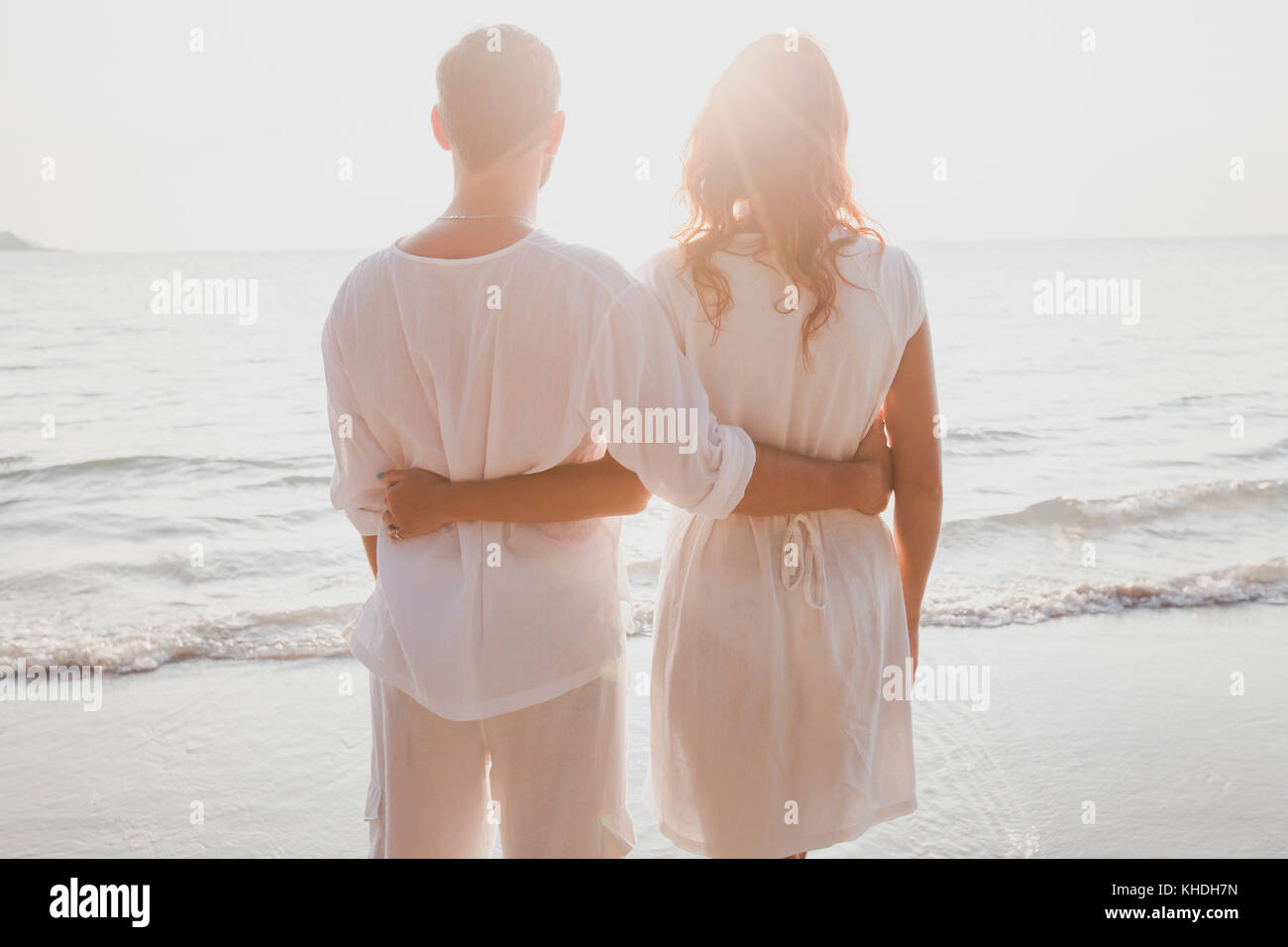 affectionate couple on the beach, honeymoon travel Stock Photo