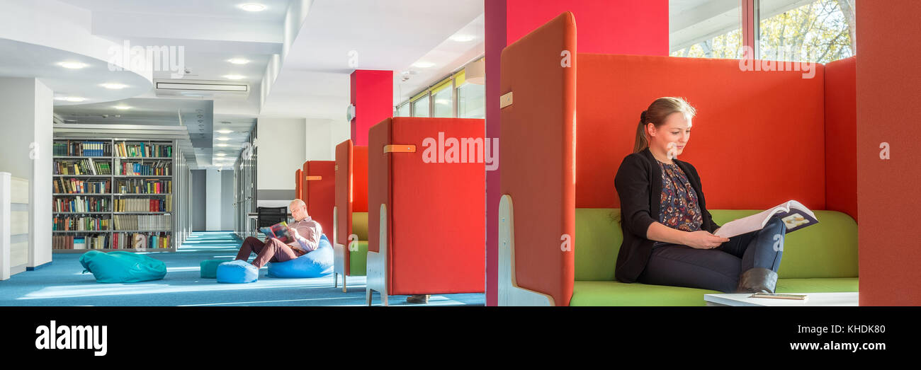 Panorama of modern library with individual study area with red ...