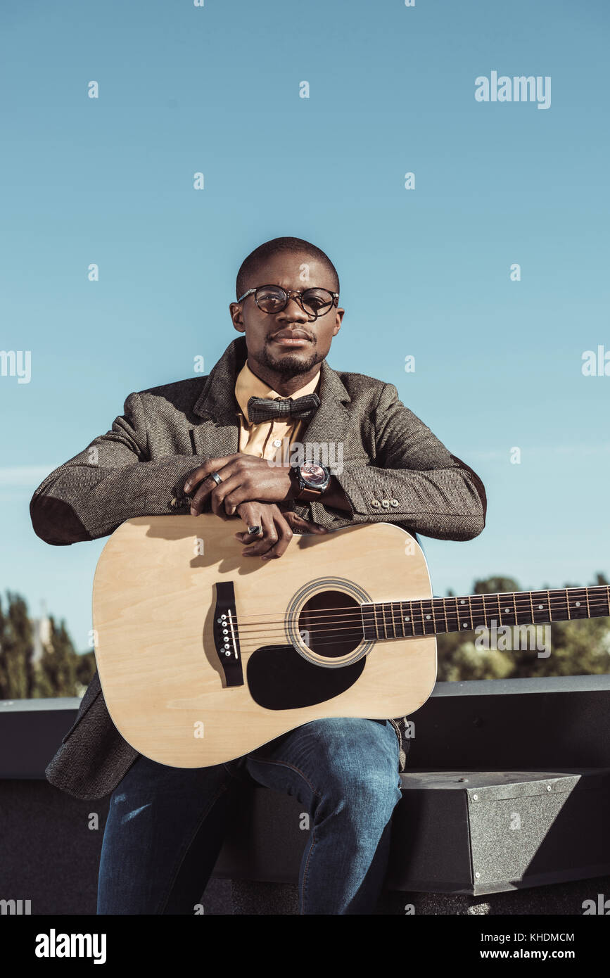 Stylish african american man with guitar Stock Photo - Alamy
