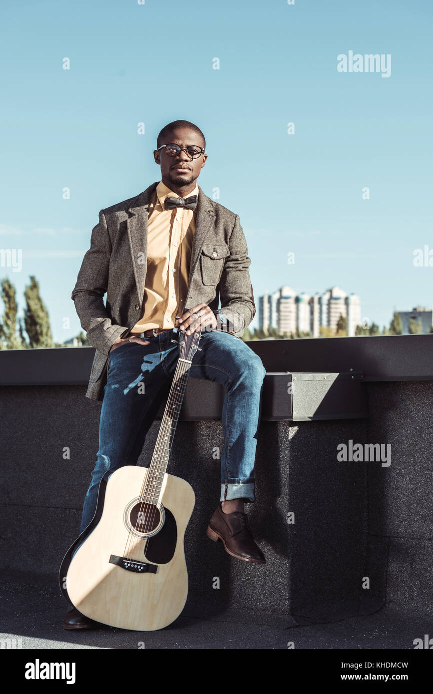 african american man on rooftop with guitar Stock Photo - Alamy