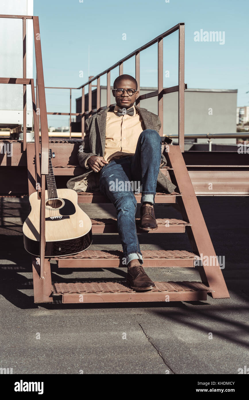 african american man on stairs with guitar Stock Photo - Alamy