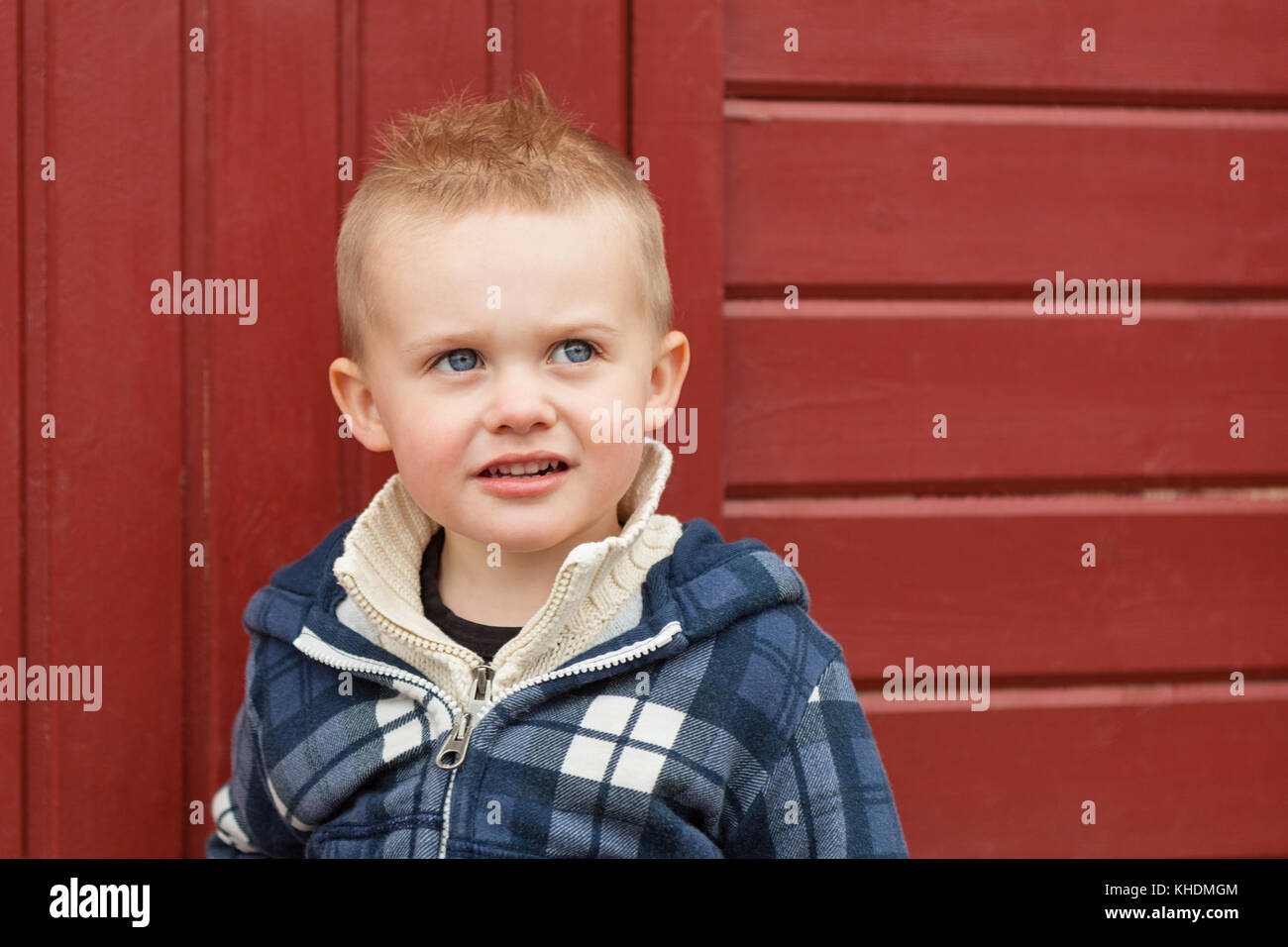 Outdoor portrait of young 2 year old caucasian boy in front of red wooden  background Model Release: Yes. Property Release: No Stock Photo - Alamy
