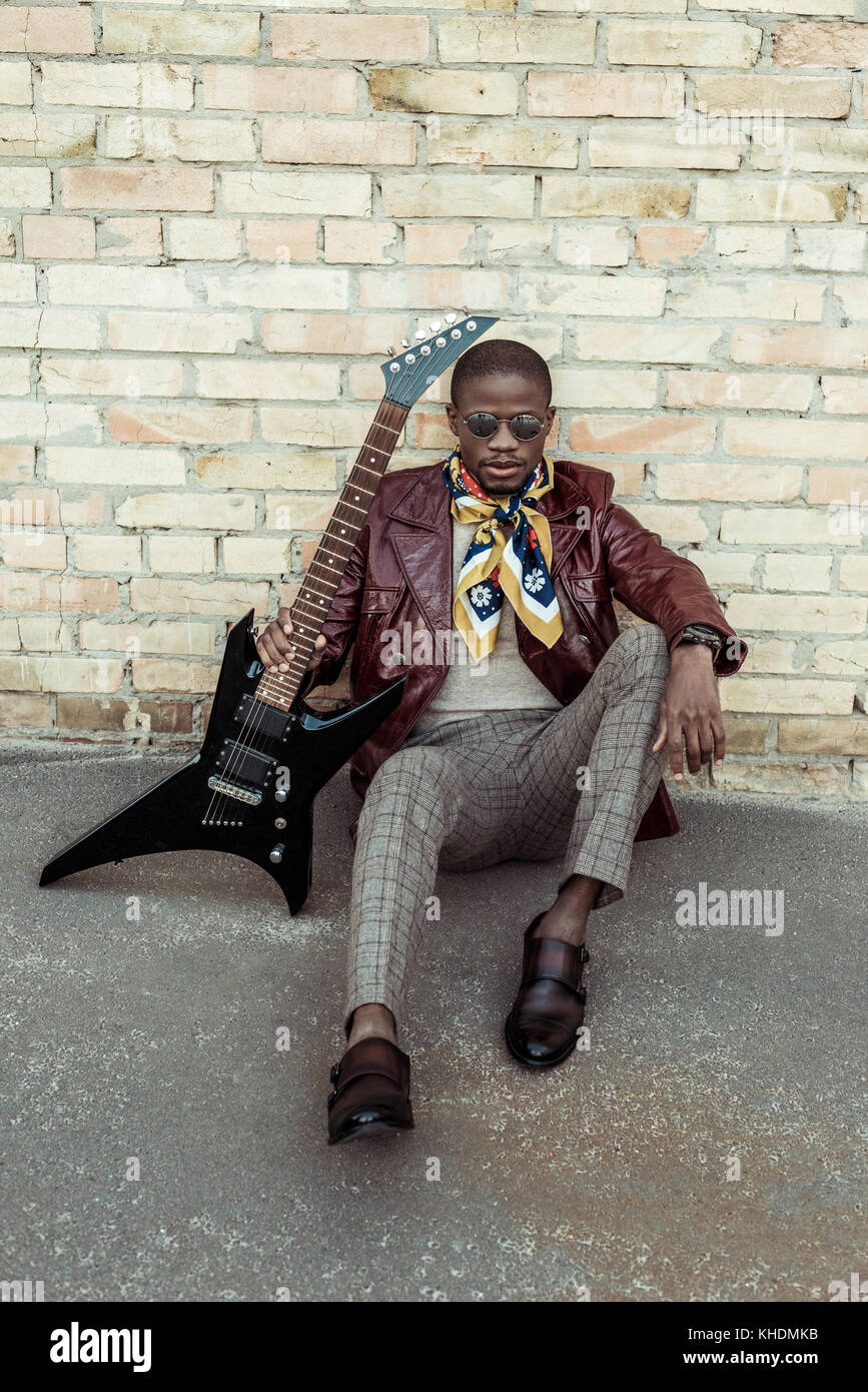 Fashionable african american with guitar Stock Photo - Alamy