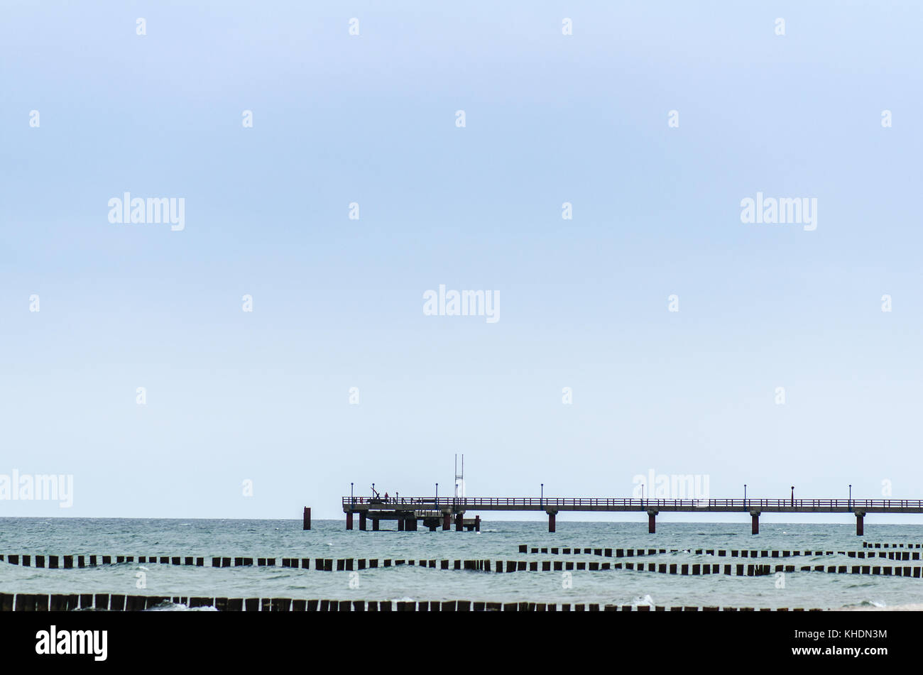 baltic sea with wooden pier and groyne field Stock Photo