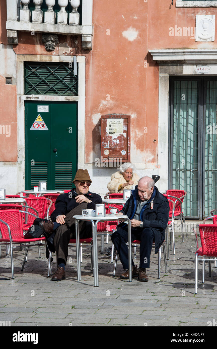 People sitting outside a restaurant bar, Campo Santa Margherita, Venice, Veneto, Italy Stock Photo