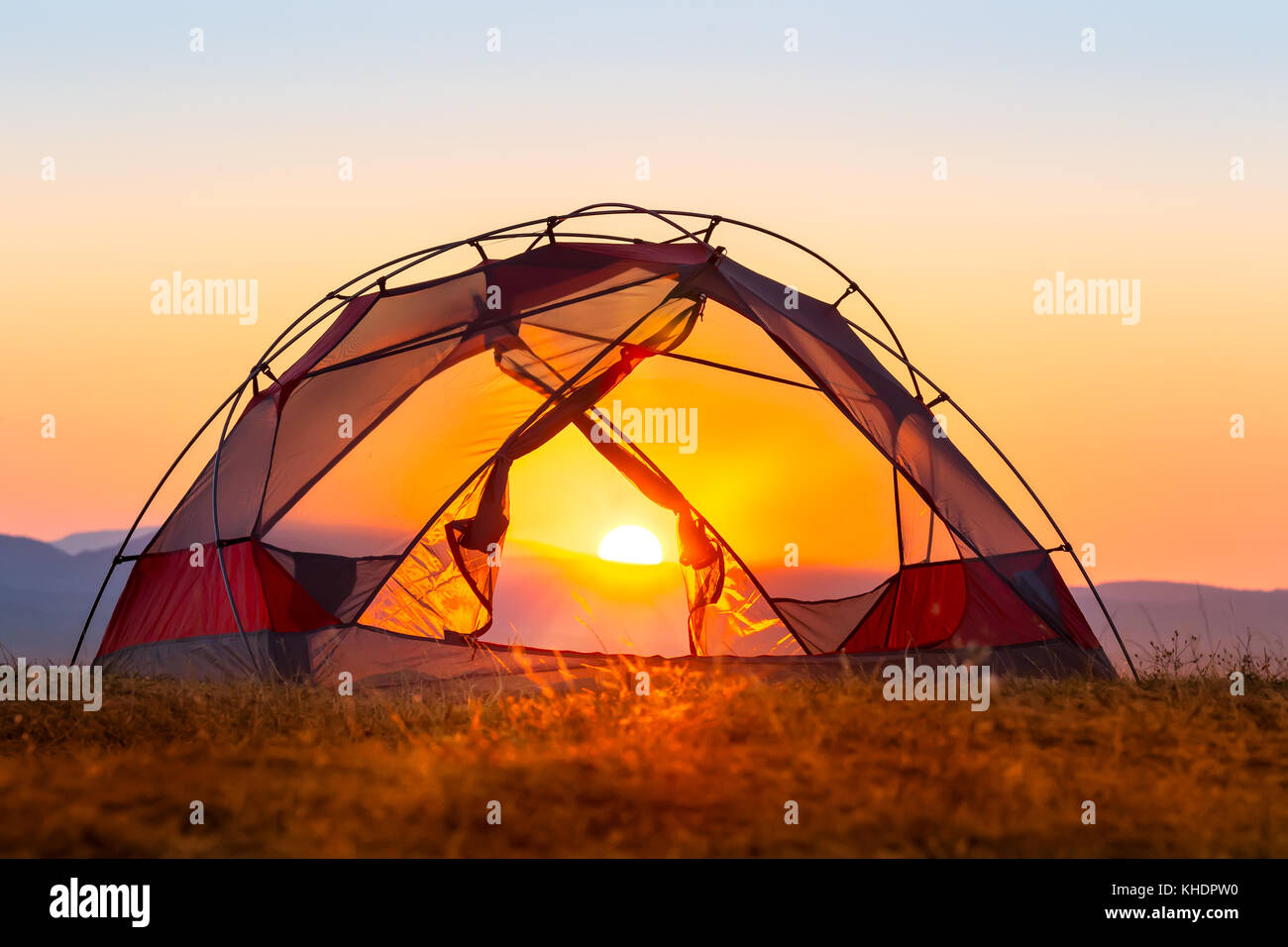 Tent without fly on a hill in the sunset light Stock Photo Alamy