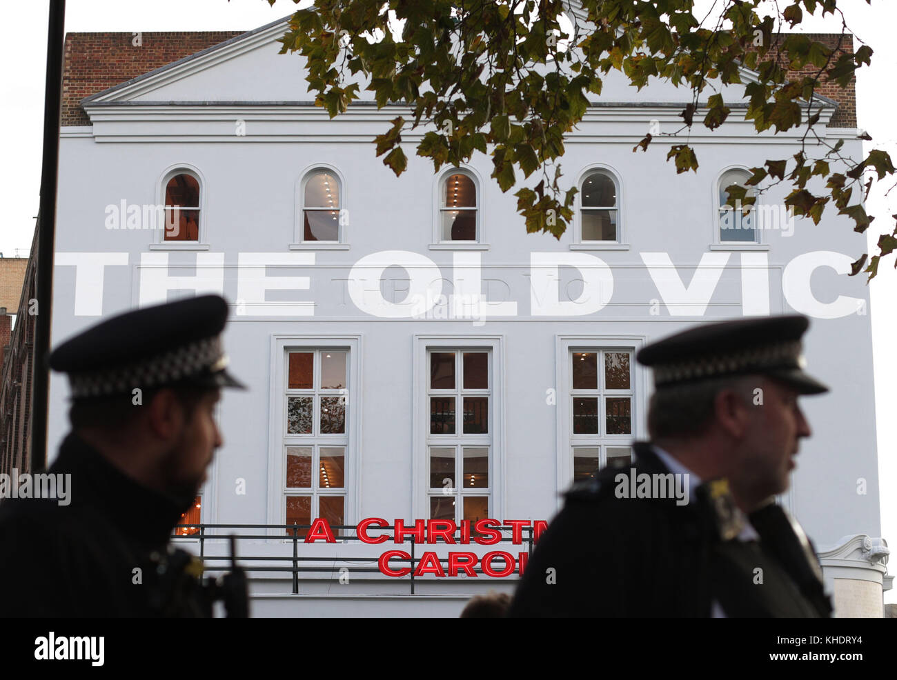 Police officers walk past The Old Vic theatre in Waterloo, London, following claims that 20 people were victims of &quot;inappropriate behaviour&quot; by Kevin Spacey. Stock Photo