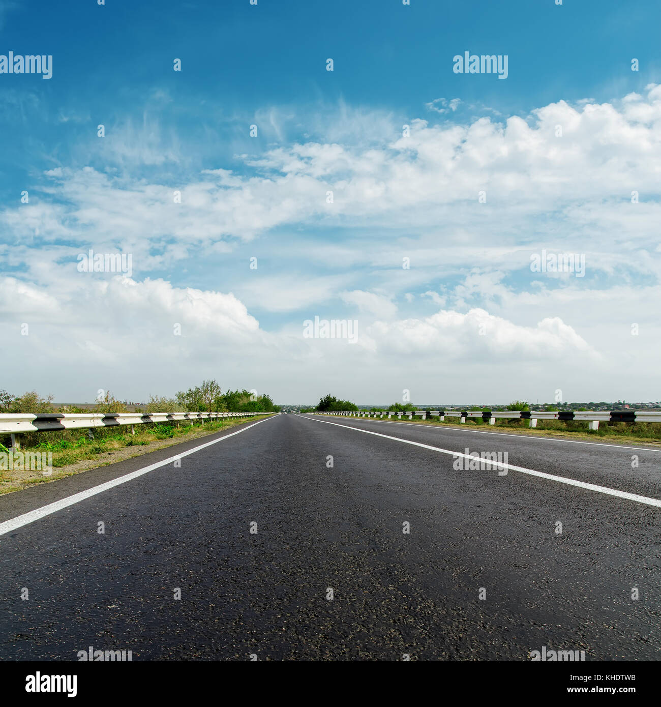 black asphalt road and cloudy horizon Stock Photo - Alamy