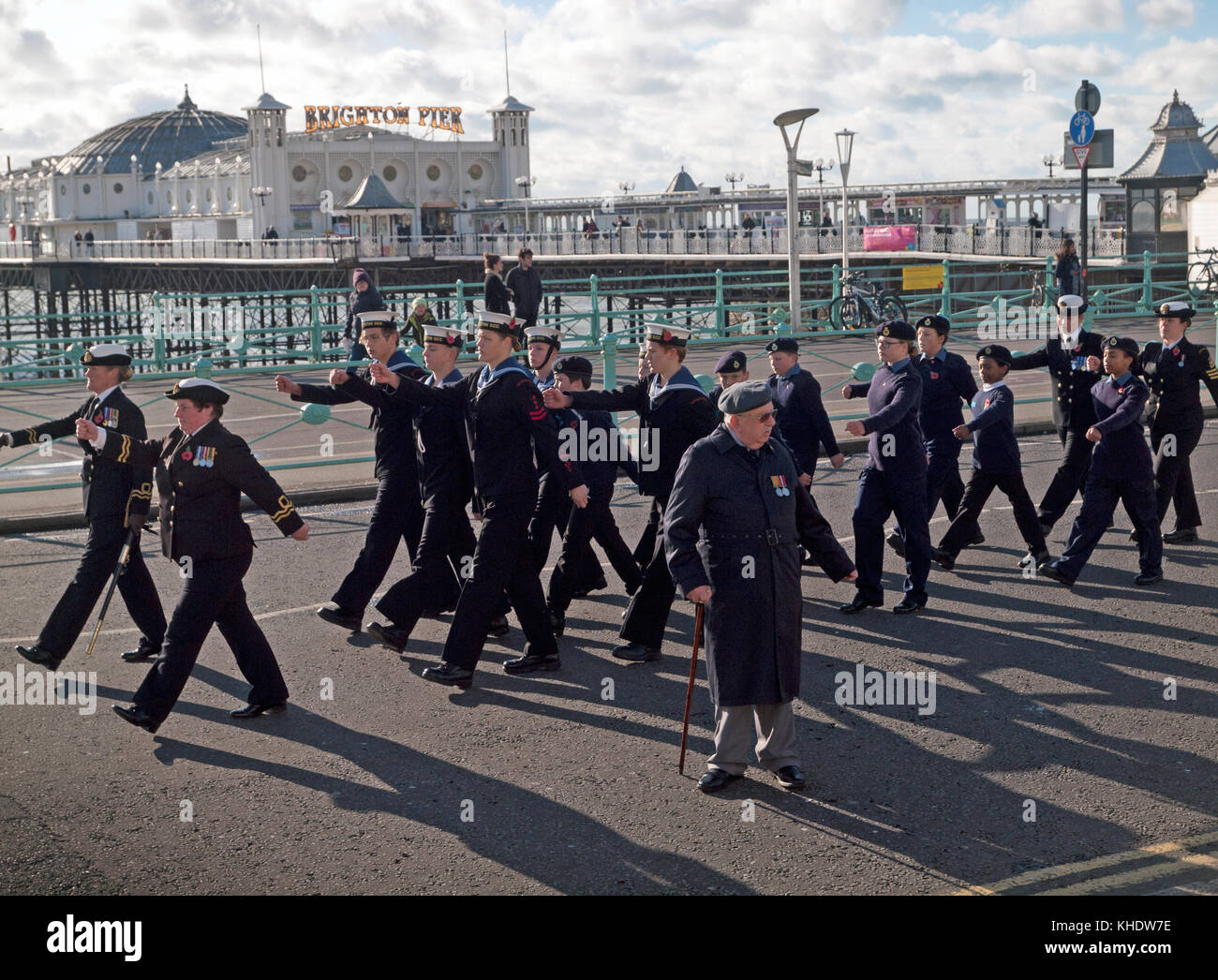 marchingSea cadets march along the Brighton seafront on Remembrance Day Stock Photo