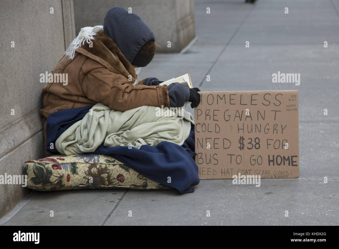 Homeless, pregnant woman asks for help along 5th Avenue in New York