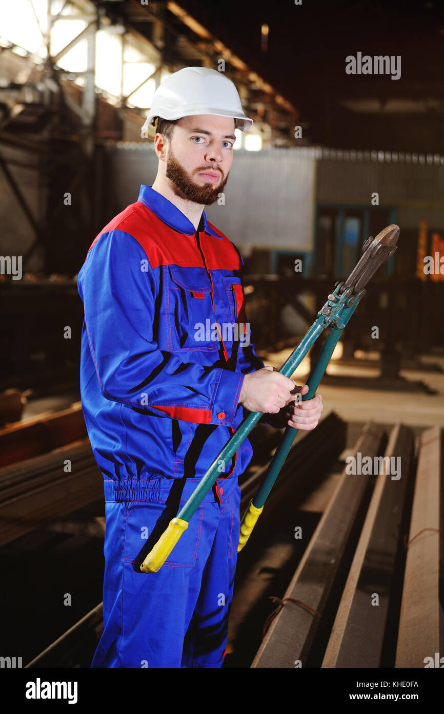 Cute man with a bolt cutter in his hands Stock Photo Alamy
