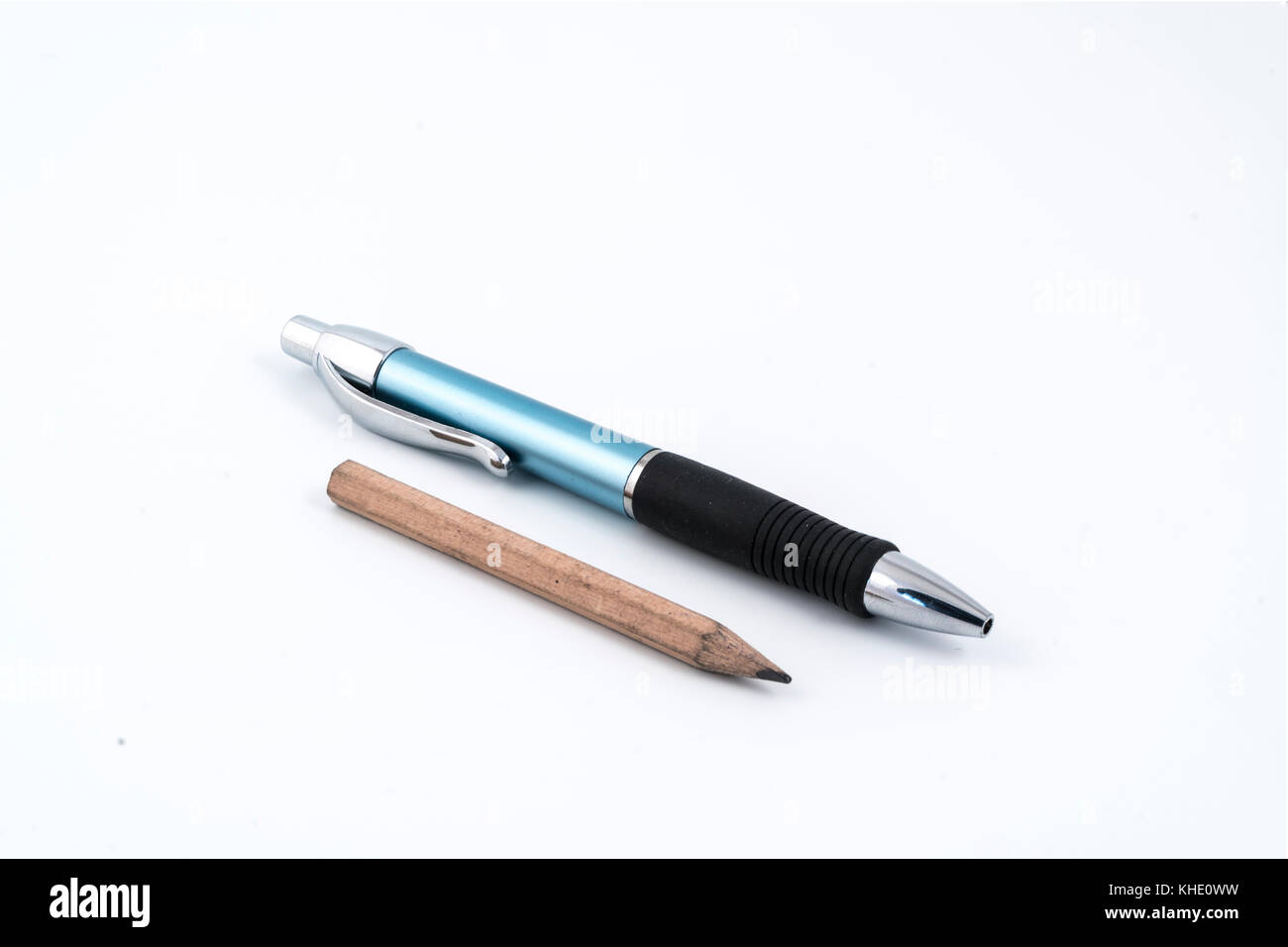 a ballpoint pen and a pencil on a white background Stock Photo