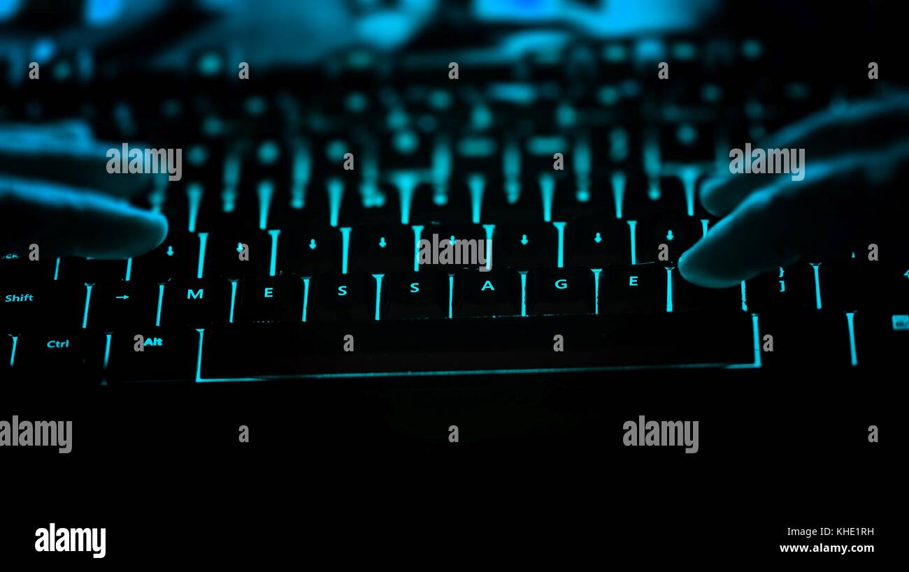 Message - text on illuminated computer keyboard at night. Internet ...