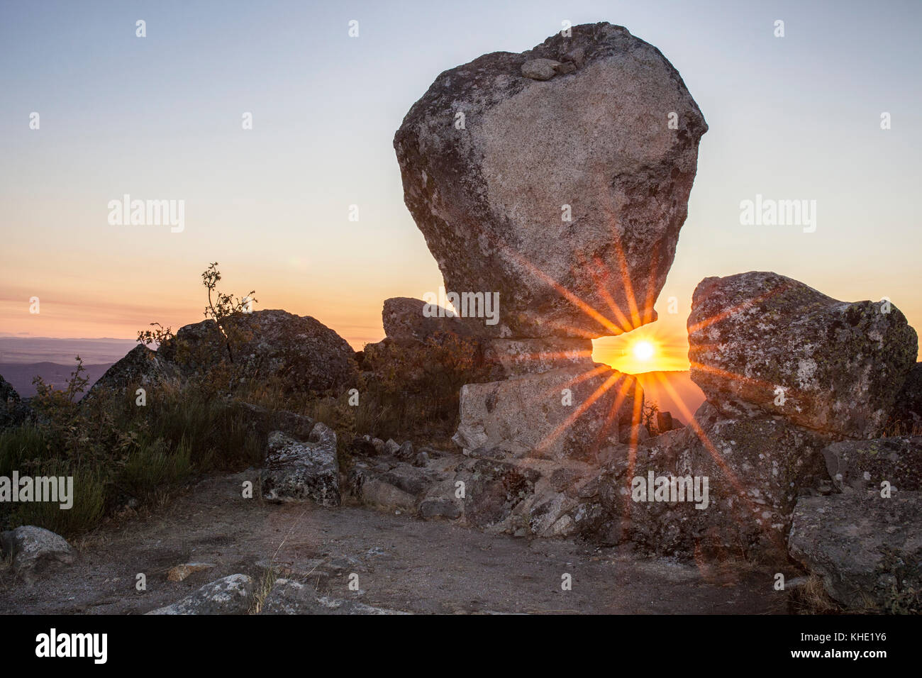 Sun rising between megalithic monument of Cancho Que Se Menea. In ...