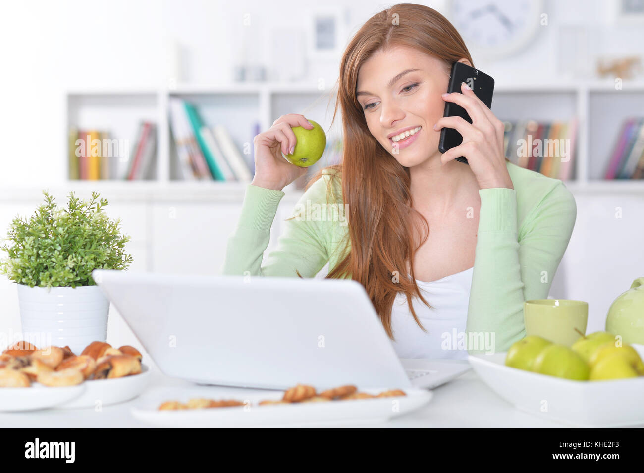 young woman using laptop Stock Photo - Alamy