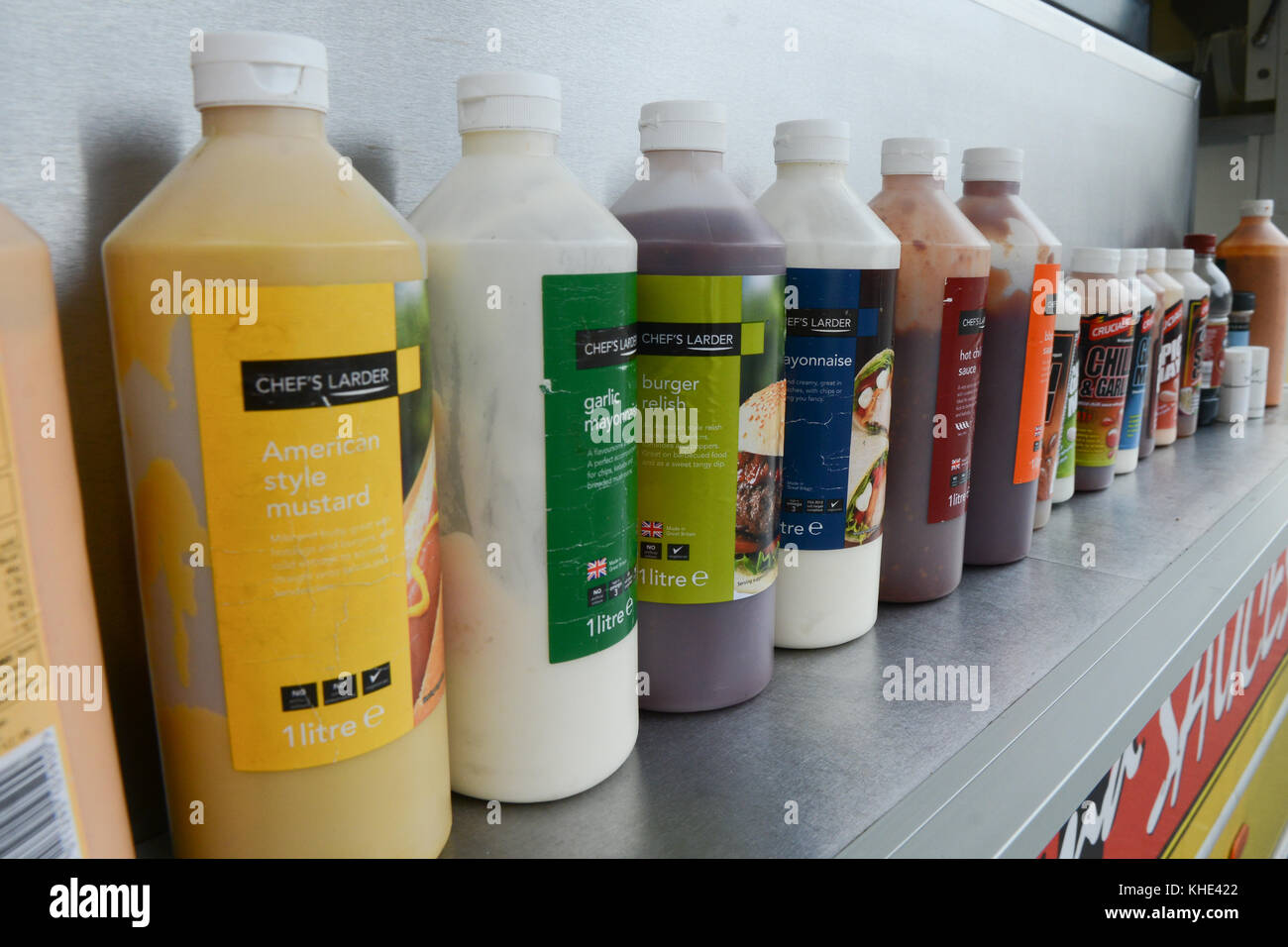 A variety of sauces on offer at a roadside burgervan Stock Photo