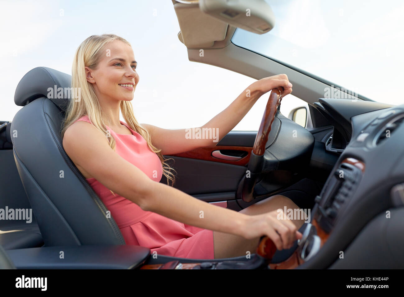 happy young woman in convertible car Stock Photo - Alamy
