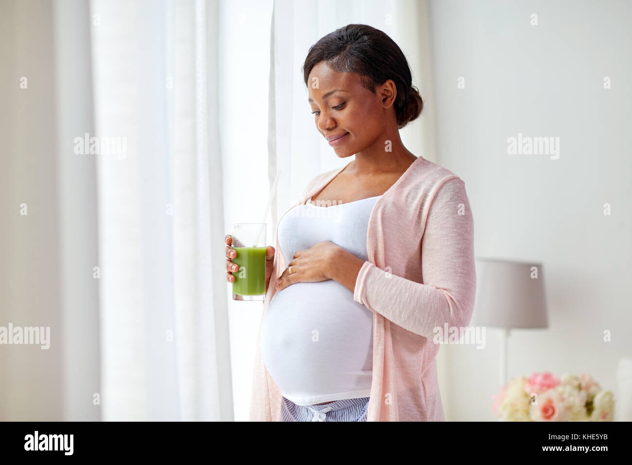 pregnant woman drinking vegetable juice at home Stock Photo Alamy