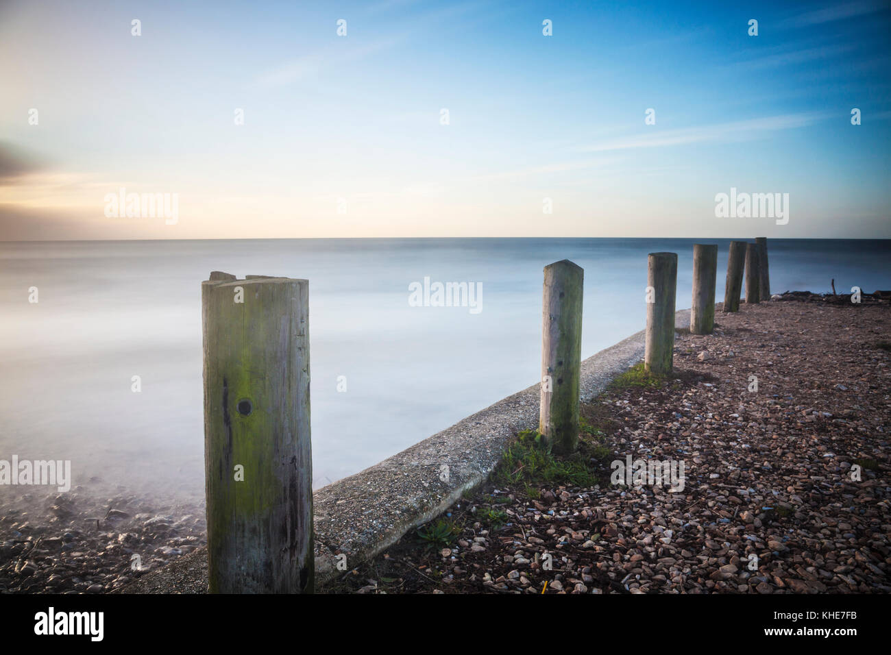 A simple image of groynes on the beach at Charmouth in Dorset. Stock Photo