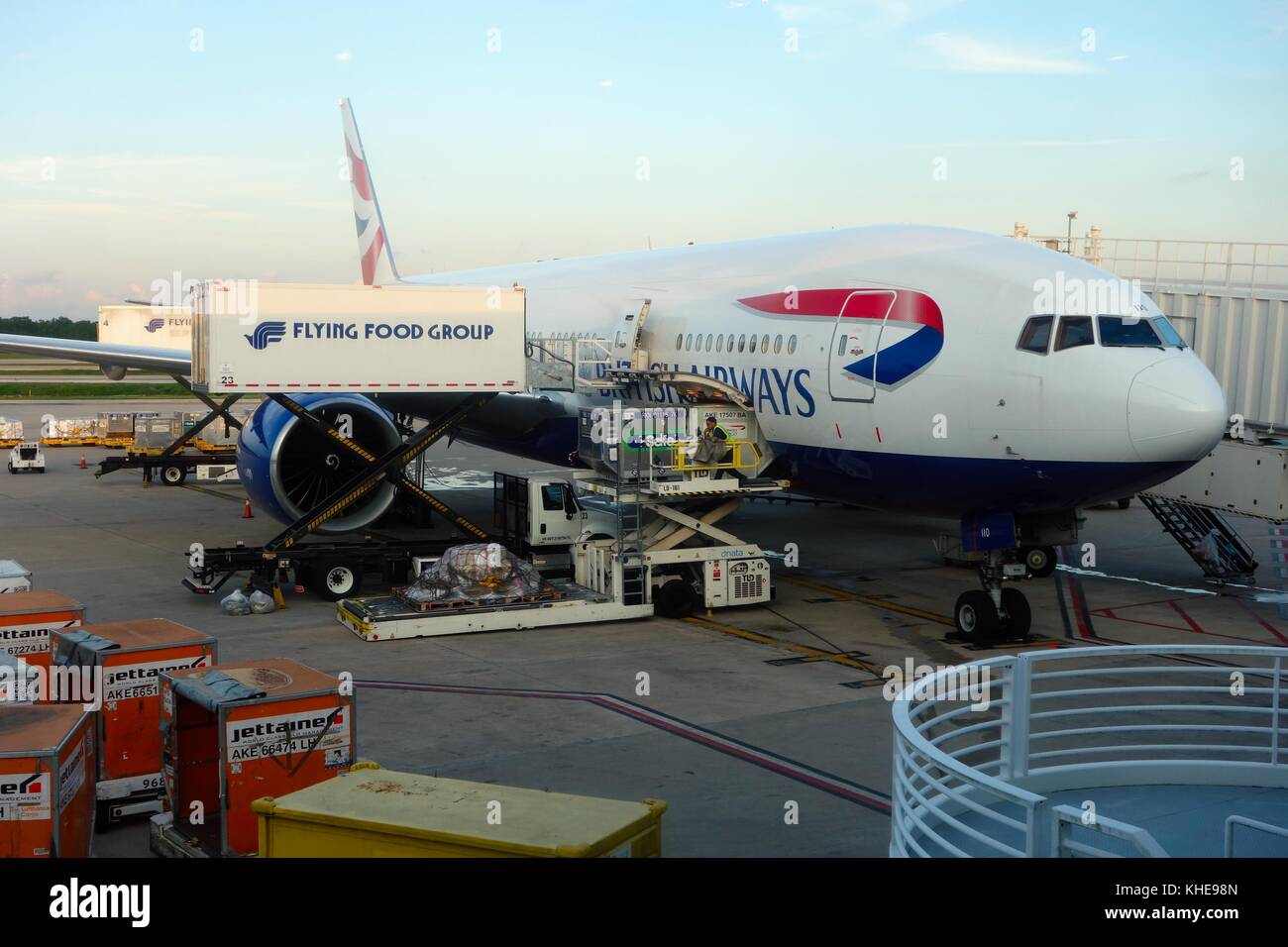 A British Airways jet being serviced by Flying Food Group scissor lifts at Orlando International Airport, Florida, USA Stock Photo