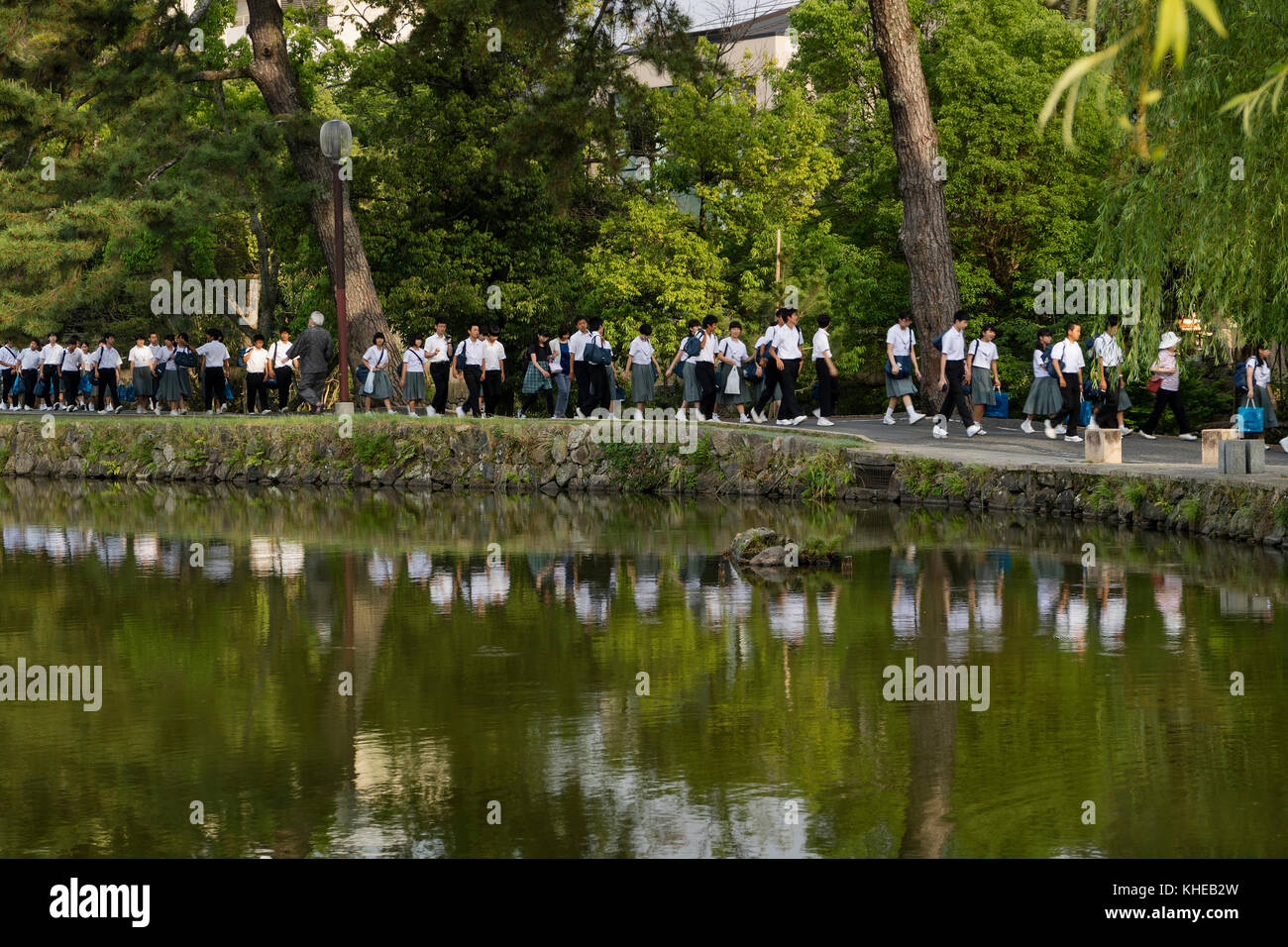 Nara, Japan -  May 30, 2017: Groups of Japanese students walking along the Sarusawa-ike, Sarusawa pond in Nara on a school trip Stock Photo