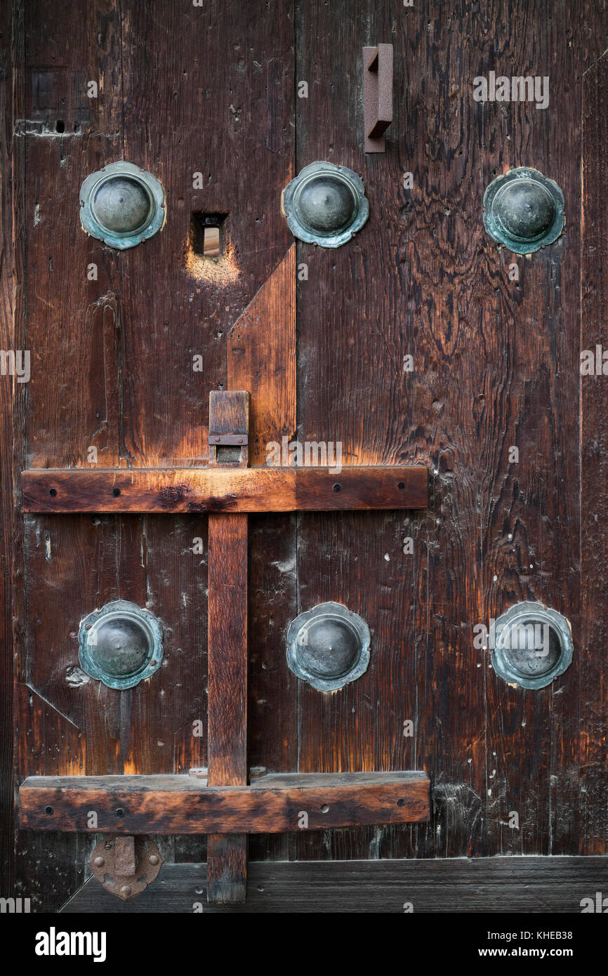 Nara, Japan - May 31, 2017: Ancient wooden door with bronze ornaments at the Kofukuji Temple Stock Photo