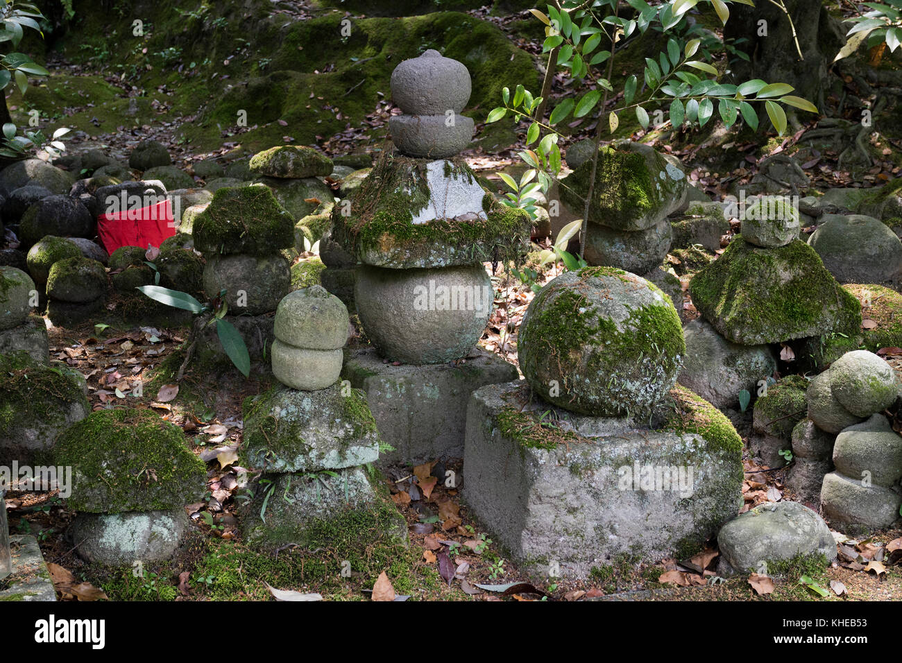 Iga Ueno - Japan, June 1, 2017:  Piled up stones symbolizing Jizo covered with moss in Ueno park Stock Photo