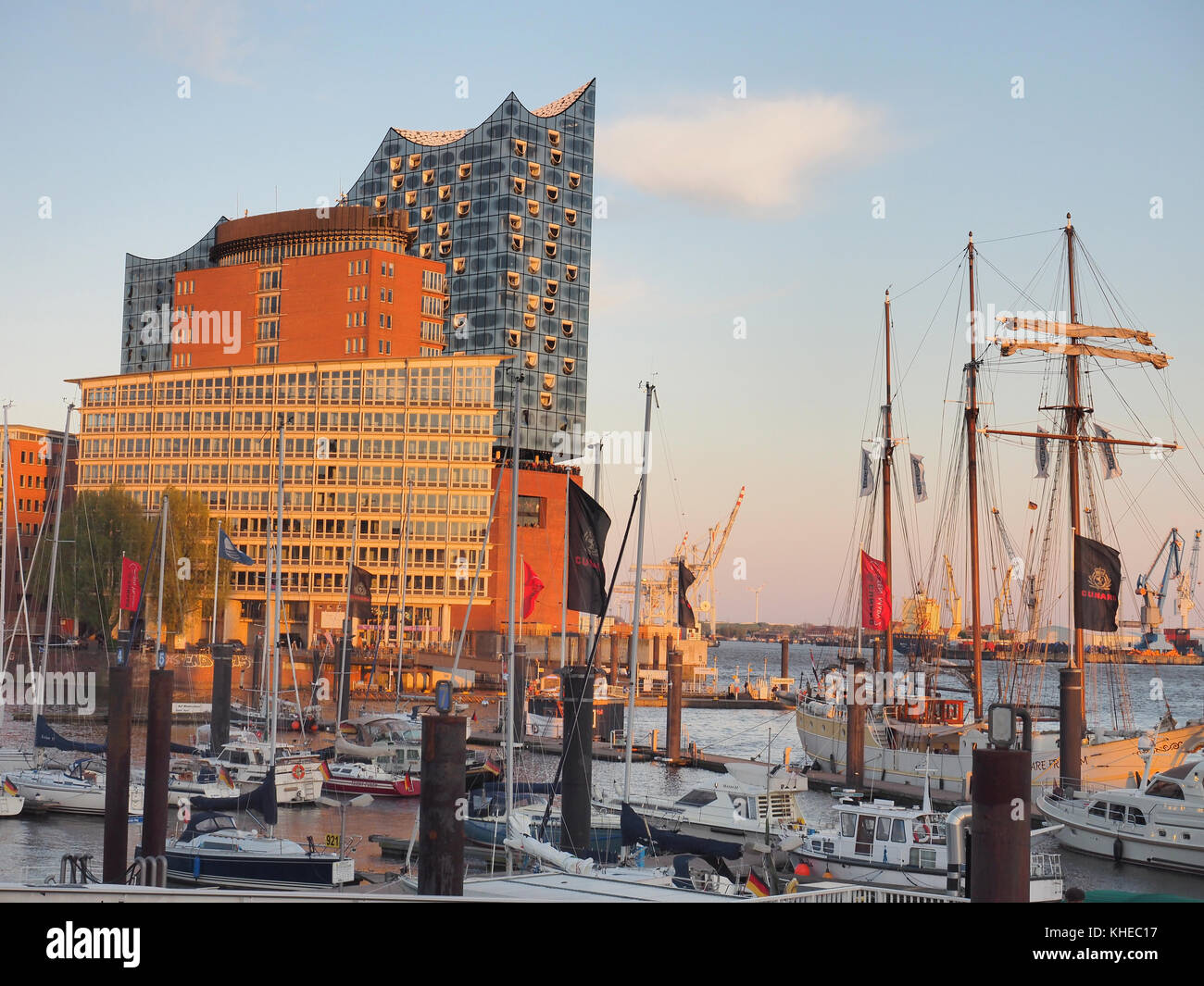 view from Lower Harbour across the Elbe river on Elbphilharmonie. The new landmark of Hamburg contains concert halls, a hotel and apartements and was designed by swiss architects Herzog and De Meuron, Hamburg, Germany Stock Photo