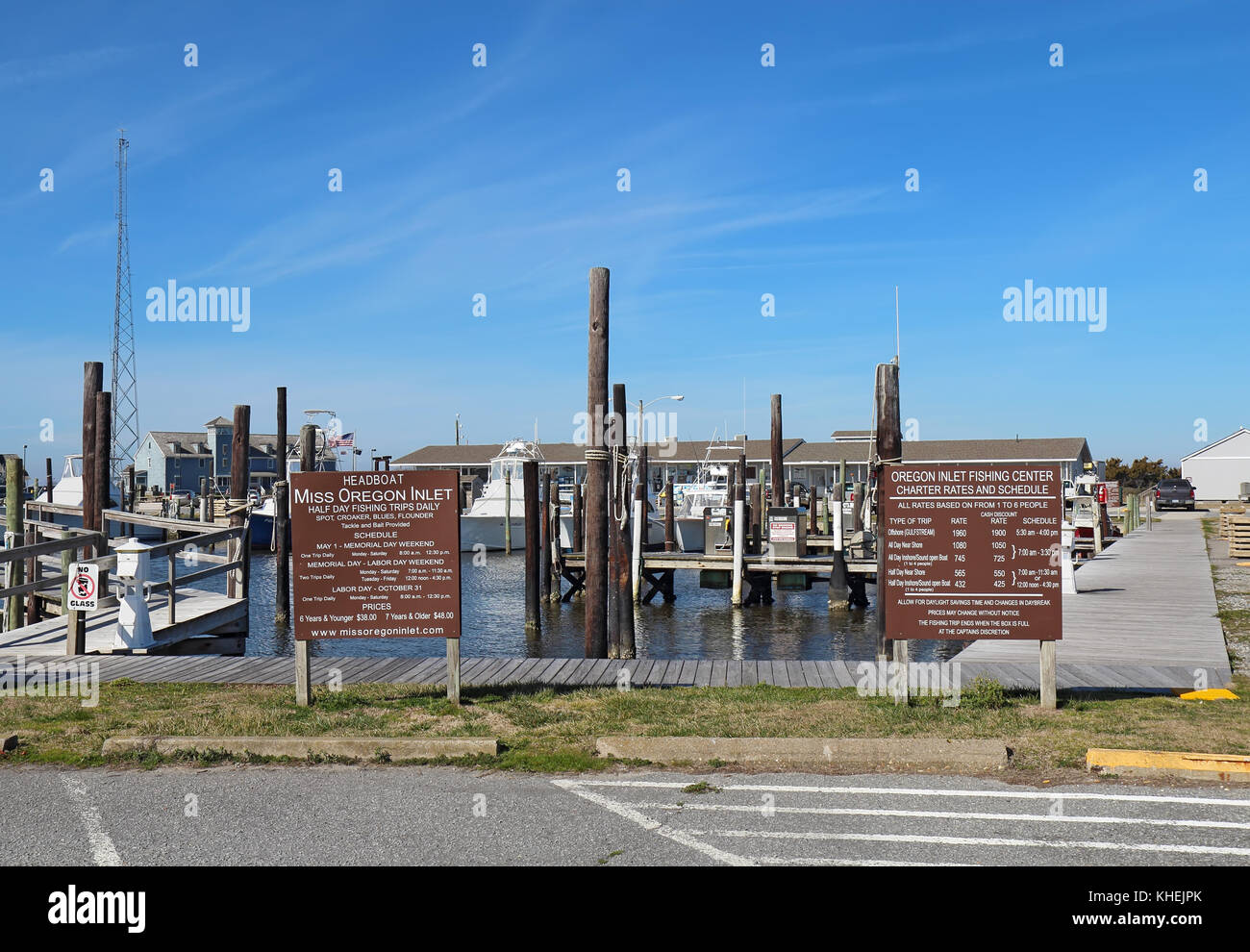 NAGS HEAD, NORTH CAROLINA - FEBRUARY 20 2017: Signs and schedules for charter fishing boats into the waters of Pamlico Sound and the Atlantic Ocean fr Stock Photo