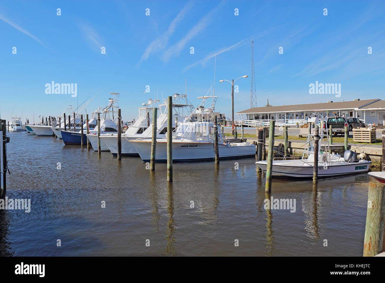 NAGS HEAD, NORTH CAROLINA - FEBRUARY 20 2017: Charter fishing boats and store for excursions into the waters of Pamlico Sound and the Atlantic Ocean a Stock Photo